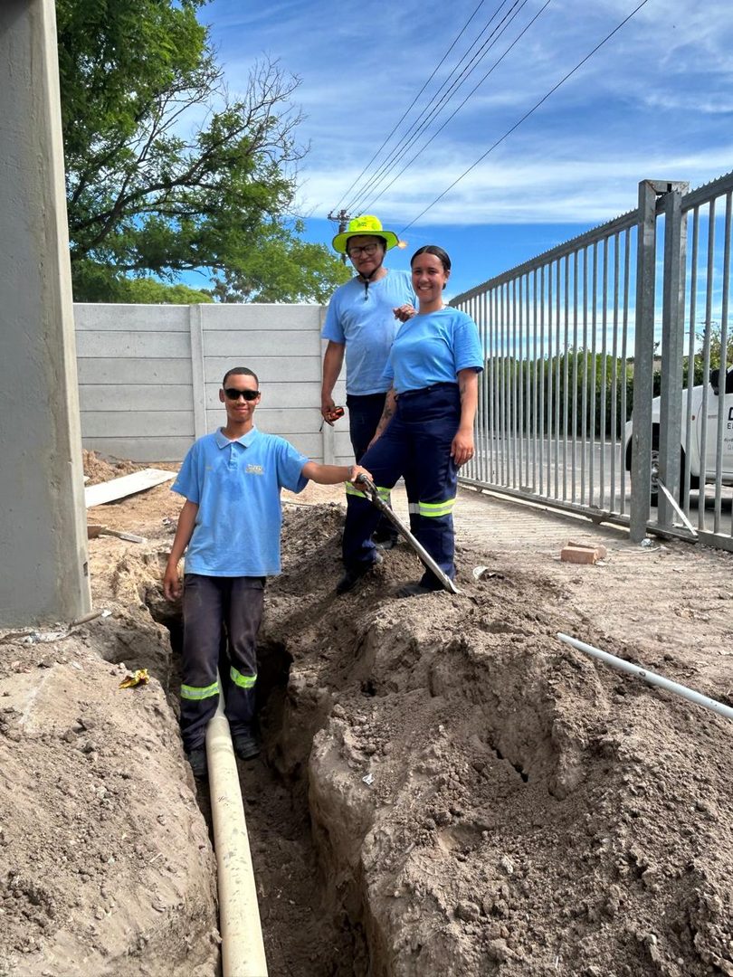 DJVD team laying underground cable for power reticulation